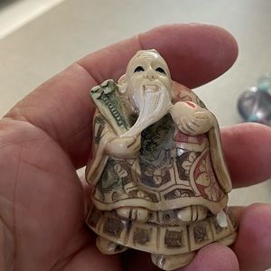 Vintage sweet little man sitting on a turtle